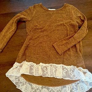 Cute brown sweater with lace trim.